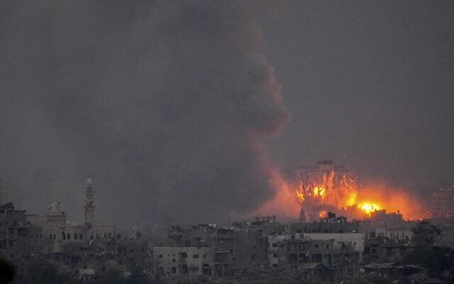 Smoke and fire rise following an Israeli airstrike in the Gaza Strip, as seen from southern Israel, Oct. 14, 2023. (AP Photo/Ariel Schalit)